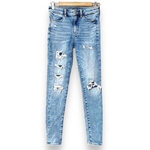 American Eagle Super High Rise Jegging 2 skinny jeans distressed patched stretch